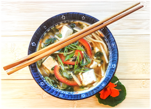 Miso noodle soup in a bowl with chopsticks