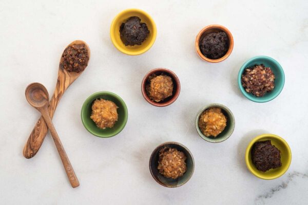 Eight dollops of miso in colorful bowls