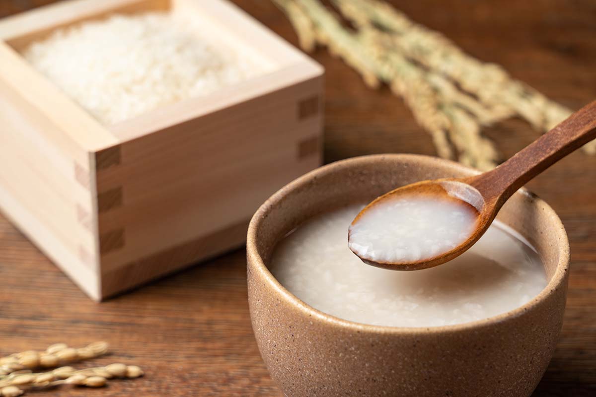 Spoonful of amazake scooped out of a bowl